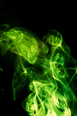 Green smoke on black background.