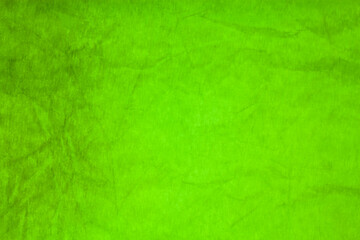 Green paper crumpled texture background.