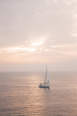 Fototapeta premium Beautiful landscape overlooking the sea at sunset where a sailing boat sailing in Croatia.