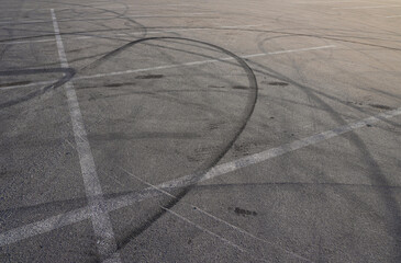 Aerial top view abstract texture and background of car tire drift skid mark on road race track,...