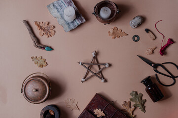 Mystical minimalistic spiritual background with occult objects flat lay beige pentagram ritual