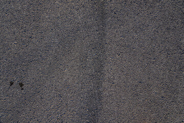 Aerial top view abstract texture and background of car tire drift skid mark on road race track, Black tire mark on street race track, Automobile and automotive concept.