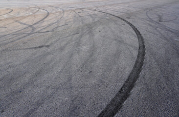 Aerial top view abstract texture and background of car tire drift skid mark on road race track,...