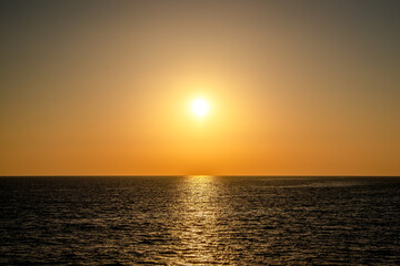 Sunset into the sea horizontal