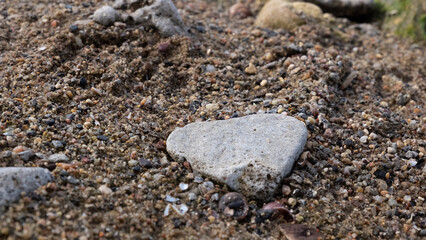 stone look like a heart on th sand