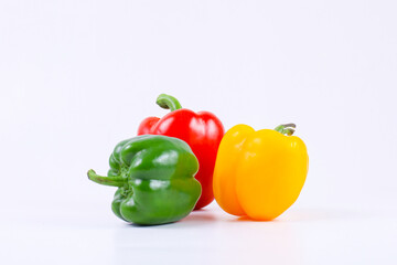 Fresh Organic paprika in red green and yellow colors isolated on white background