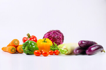 Assorted fresh organic vegetables isolated on white background.
