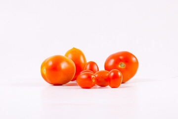 Fresh Organic cherry plump tomatoes isolated on white background.
