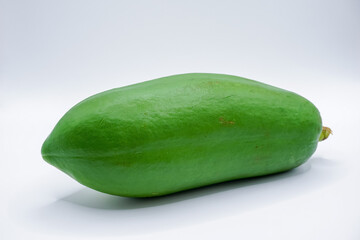 Green papaya on a white background.