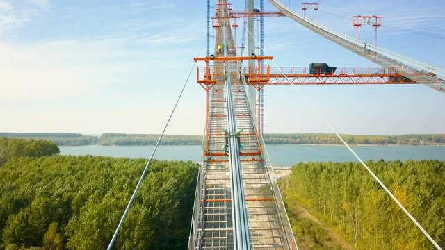Tulcea, Romania - 20 October 2021: The construction of a new suspension bridge over the Danube, the third longest bridge in Europe