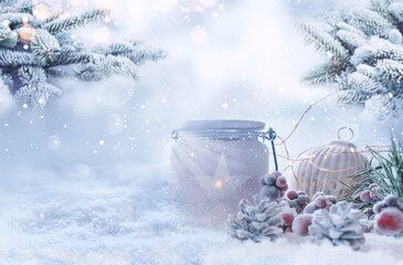 Christmas decoration in snow with fir branches and bright bokeh. Background for christmas and...