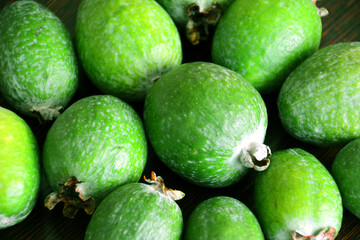 green feijoa fruit on dark background, close-up