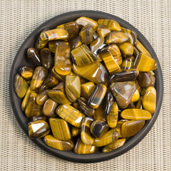 Natural mineral gem stone Tiger's eye Tigers eye, Tiger eye gemstone as nice background close up