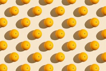 Fruit pattern of fresh ripe slice orange on yellow background. Top view, copy space for your text. Fruit composition, healthy concept.