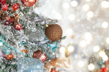 Classic Christmas New Year decorated New year tree with silver and white ornament decorations toy and ball. Modern classical style interior design apartment. Christmas eve at home.