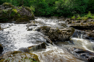 Water flowing over rocks in a river in Scotland