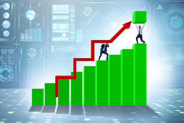 Businessman supporting economic growth on chart