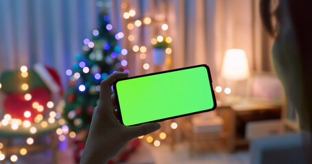 Fototapeta na wymiar woman use green screen smartphone