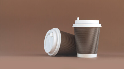 Banner of two paper corrugated coffee cup with cap