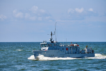 Coastguard, rescue support patrol boat for defense, military ship on high blue seas, Russian Navy