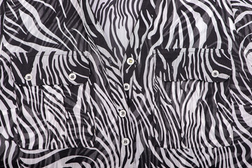 silk blouse fabric texture close-up with pockets, buttons, black and white floating line pattern