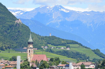 View to the village St. Pauls in Southtyrol mountains behind