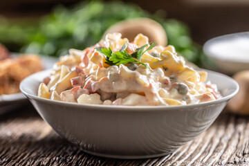 Traditional potato salad with vegetables and mayonnaise