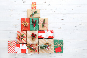 Fototapeta premium Gift boxes with ornaments on white wooden background