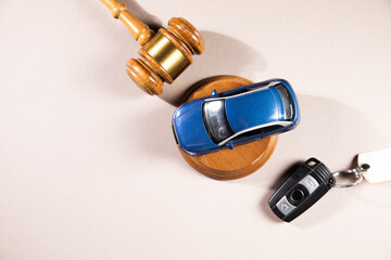 Judge gavel and car with keys