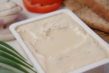 low fact cheese cream in a container on table,