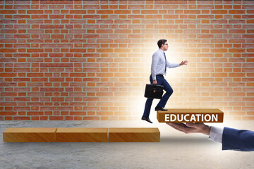 Fototapeta na wymiar Education concept with businessman on steps