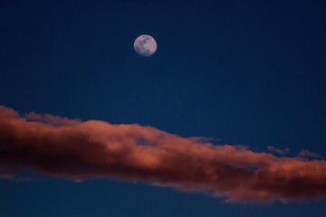 full moon over the clouds
