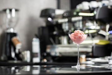 glass of ice cream scoops, top view with copy space. Close Up Still Life of Scoops of berries Ice Cream on gray background