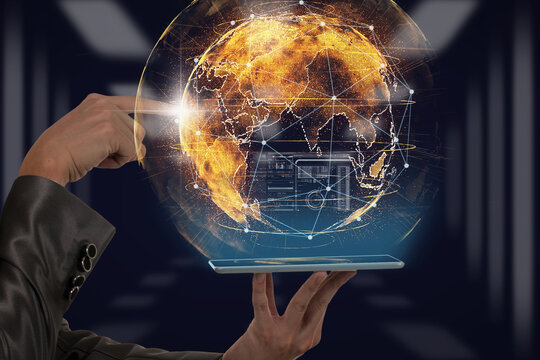 Hand holding the lablet and pointing the particle of earth over the Background blurred of server room, business innovation and technology concept