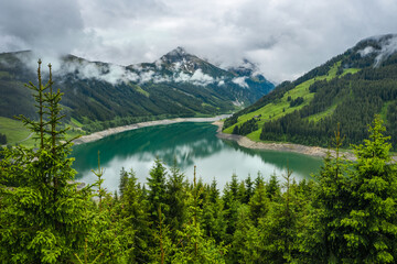 Fototapeta na wymiar Schlegeis Stausee lake view from mountain hiking path trail. Zillertal, Austria, Europe