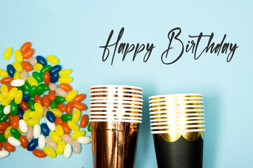 colorful jelly beans candy and disposable cups, happy birthday concept