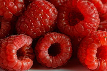 Close up of a stack of raspberries. Macro shot.