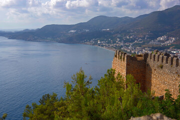 Turkey, Alanya. 09.16.21. View of the city on the coast of the sea and mountains from a height. And also the old fortress ead the city.