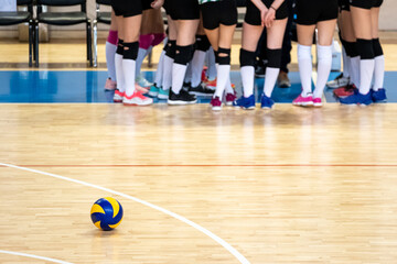 volleyball game sport with group of young  girls indoor in sport arena