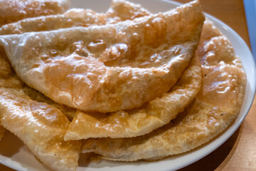 Chebureki (Çiğ börek),  a national dish of Crimean Tatar cuisine and specialty food in Eskisehir, Turkey. Close-up with selective focus