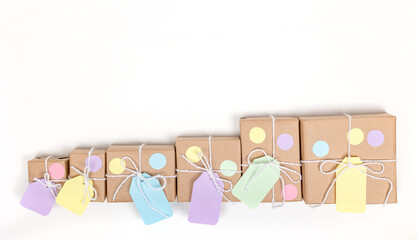 Christmas crafts paper holiday boxes on white background. Christmas winter holiday congratulation invitation birthday wedding. flat lay