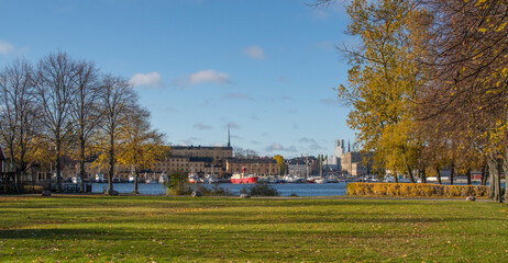 Piers with boats at the islands in the Stockholm harbor a colorful autumn day