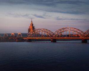 Obraz premium Railway Bridge and Latvian Academy of Sciences at sunset - Riga, Latvia