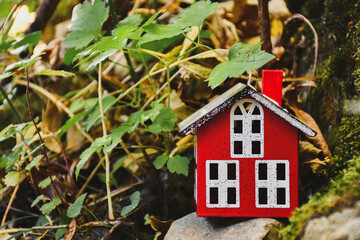 little toy red house in the forest, gnome's home, fairytale, gnome garden