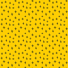 Seamless yellow background with doodle crosses
