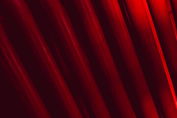 Abstract industrial background from pipes painted in red.