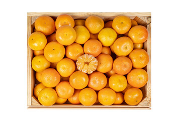 overhead view of a wooden box with many tangerines and peeled segments, isolated on white background.
