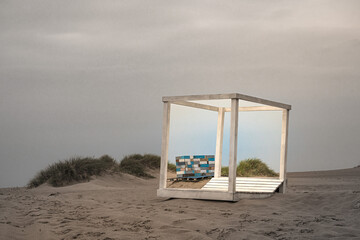 Summer light inside a frame deck chair on an autumn beach