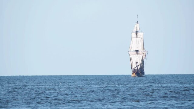 4K - Historical frigate. Sailing ship sails on the sea directly on camera