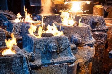 Liquid metal is poured into steel molds from metallurgical ladle.